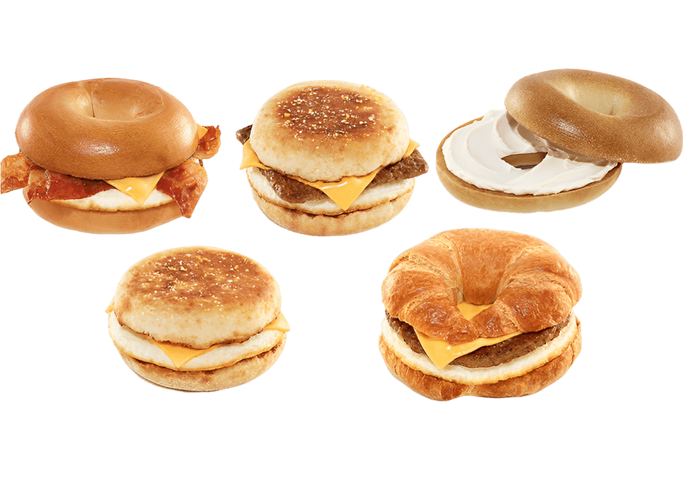 Variety of breakfast sandwiches with different breads and fillings.