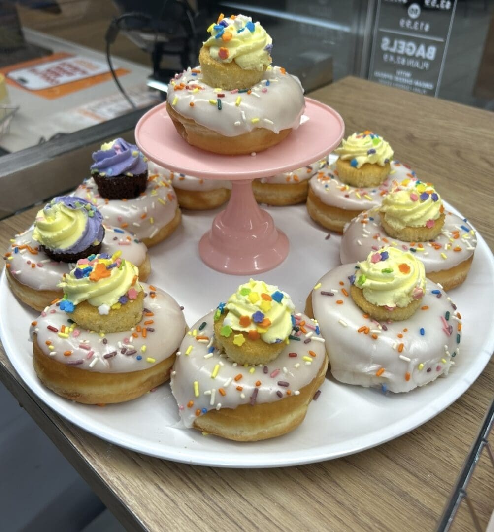 Glazed sprinkle donuts topped with mini cupcakes